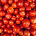 A vibrant display of fresh red tomatoes at a market in Coimbatore, India - summer harvest.